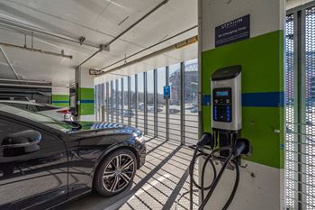a car plugged into a charging station at a gas station